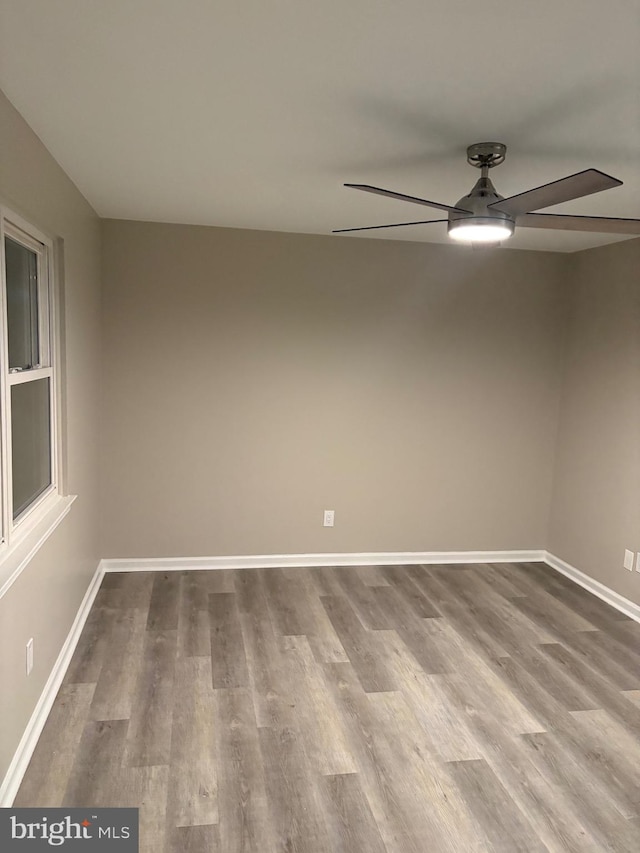 spare room with ceiling fan and hardwood / wood-style floors