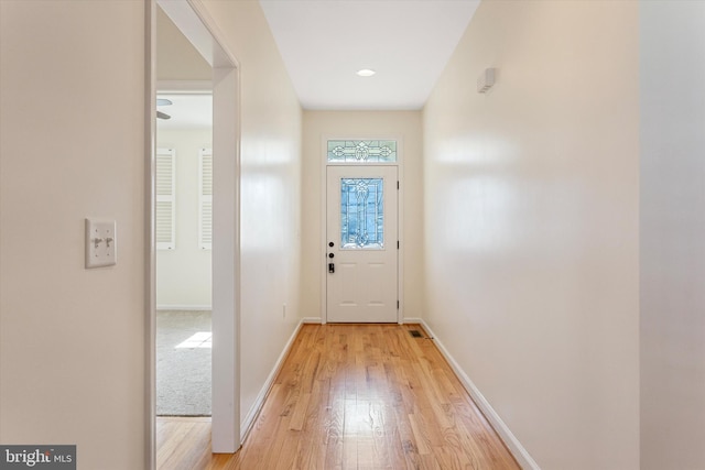 entryway with light hardwood / wood-style floors