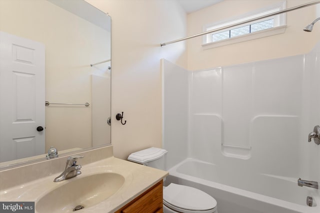 full bathroom with vanity,  shower combination, and toilet