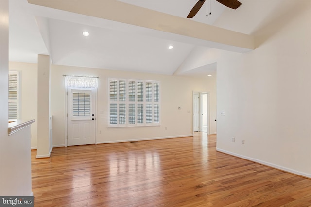 interior space featuring light hardwood / wood-style floors, high vaulted ceiling, and ceiling fan