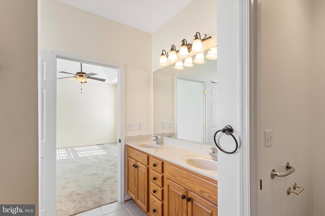 bathroom with ceiling fan, tile patterned flooring, and vanity