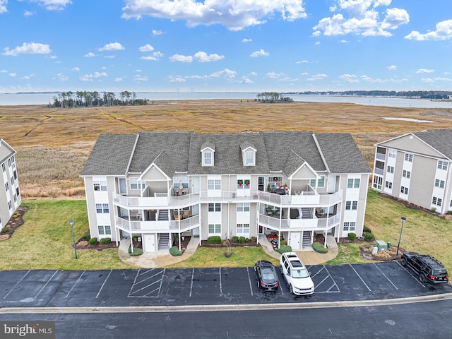 birds eye view of property with a water view