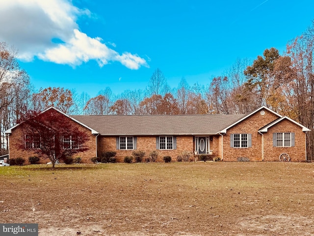 single story home featuring a front yard