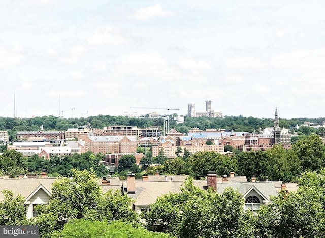 birds eye view of property featuring a city view