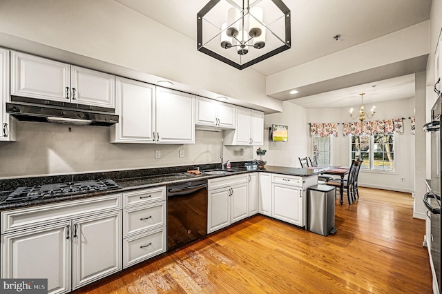 kitchen featuring white cabinetry, dishwasher, an inviting chandelier, light hardwood / wood-style flooring, and kitchen peninsula