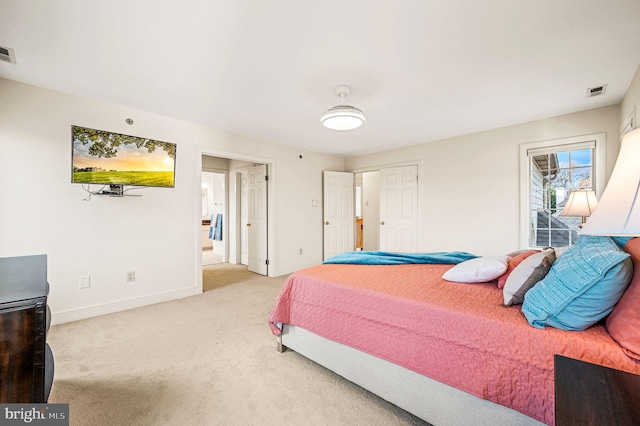 bedroom featuring light colored carpet