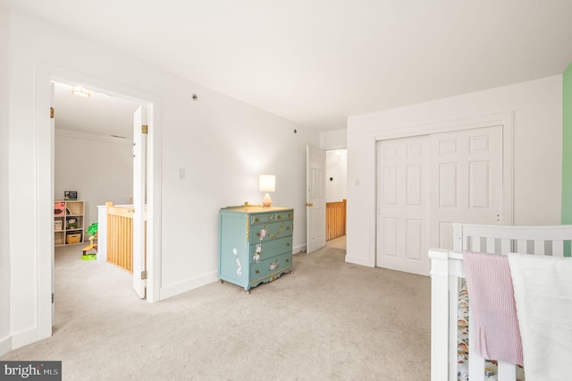 carpeted bedroom featuring a closet