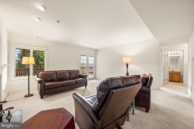 carpeted living room featuring french doors and plenty of natural light