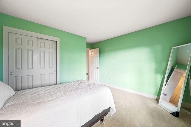 carpeted bedroom with a closet