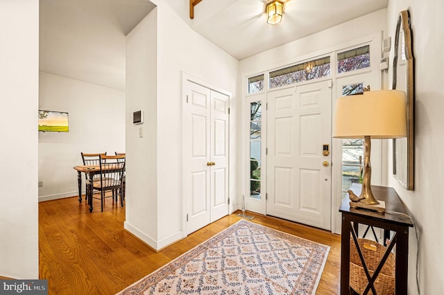 entrance foyer with hardwood / wood-style floors