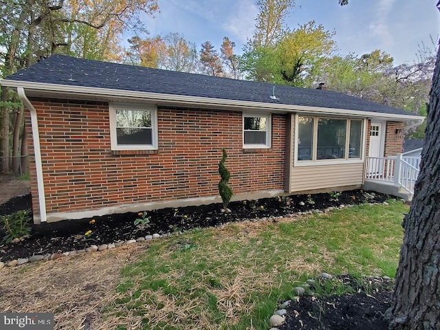 view of side of home featuring a yard