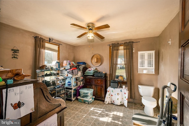 interior space featuring ceiling fan