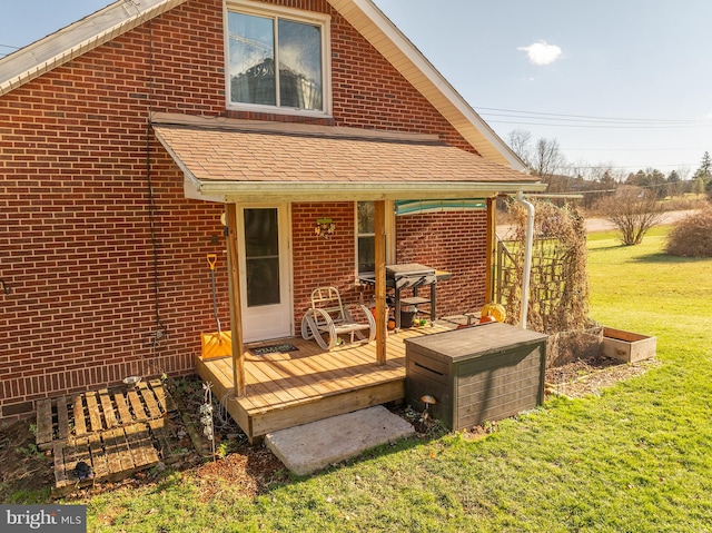 rear view of house with a yard