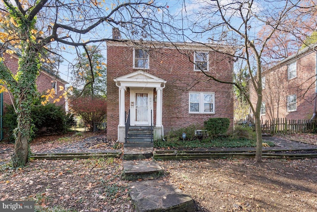841 E Belvedere Ave E, Baltimore, MD 21212 - view of front of property featuring brick siding and a chimney