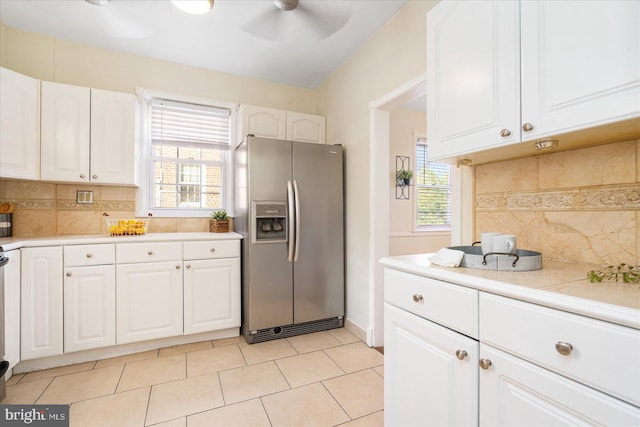 841 E Belvedere Ave E, Baltimore, MD 21212 - kitchen featuring stainless steel refrigerator with ice dispenser, a ceiling fan, and white cabinetry