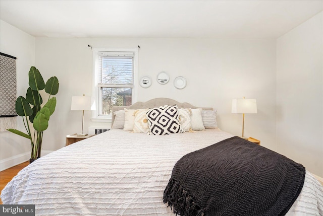841 E Belvedere Ave E, Baltimore, MD 21212 - bedroom featuring wood finished floors and baseboards