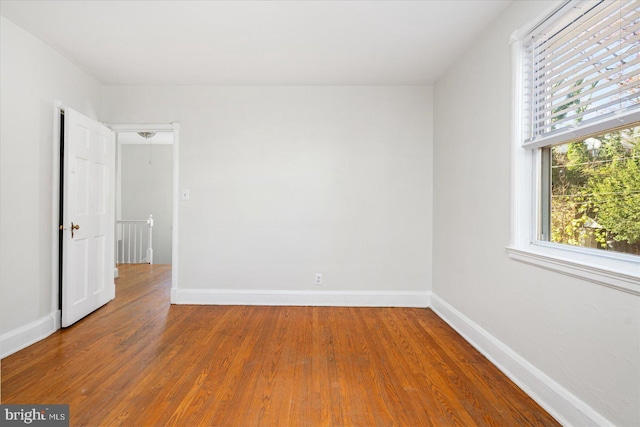 841 E Belvedere Ave E, Baltimore, MD 21212 - empty room with wood finished floors and baseboards