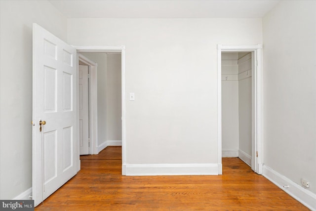 841 E Belvedere Ave E, Baltimore, MD 21212 - unfurnished bedroom featuring wood finished floors and baseboards