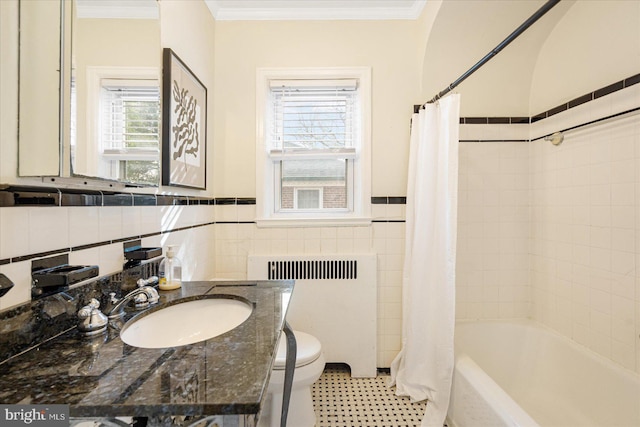 841 E Belvedere Ave E, Baltimore, MD 21212 - bathroom with radiator, tile walls, toilet, shower / bath combo, and ornamental molding