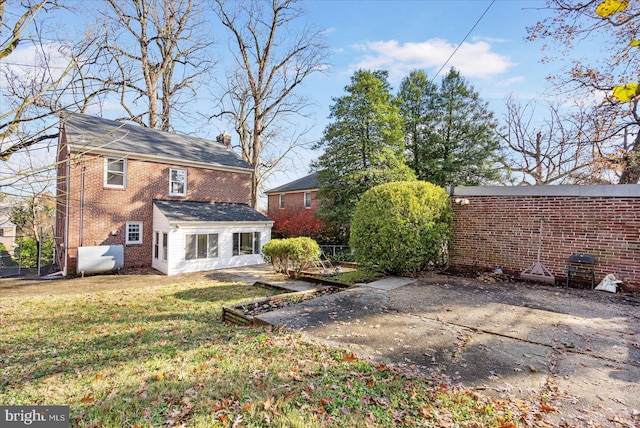 841 E Belvedere Ave E, Baltimore, MD 21212 - back of property with brick siding and a patio area