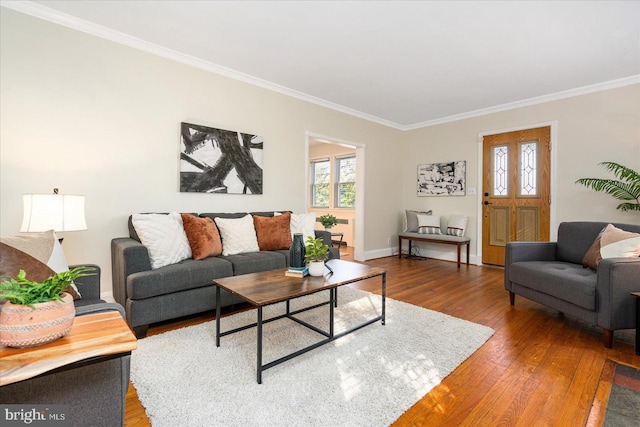 841 E Belvedere Ave E, Baltimore, MD 21212 - living area featuring crown molding, wood finished floors, and baseboards