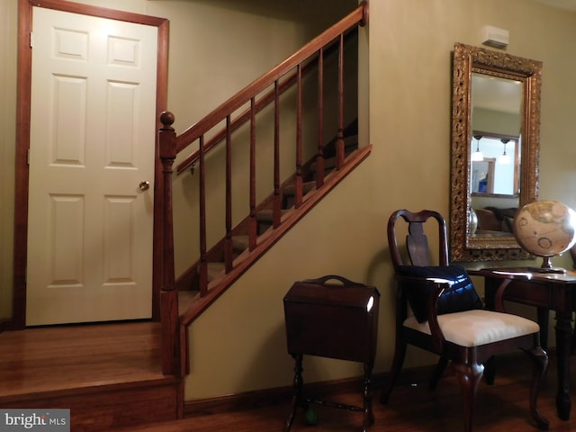 staircase featuring hardwood / wood-style flooring