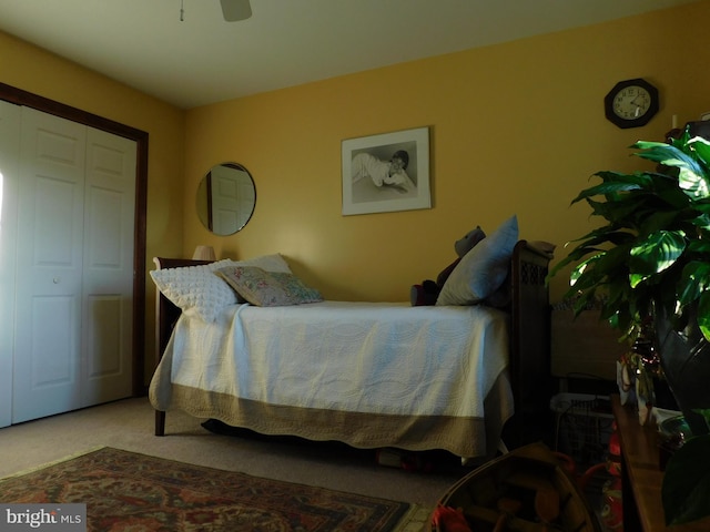 bedroom featuring carpet flooring, ceiling fan, and a closet