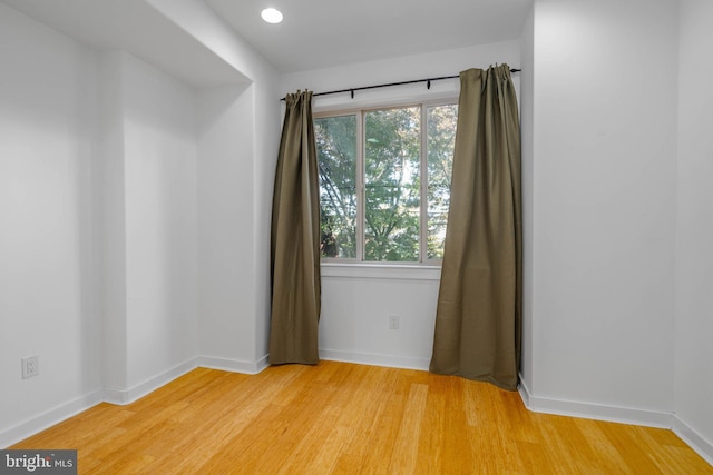 unfurnished room featuring wood-type flooring