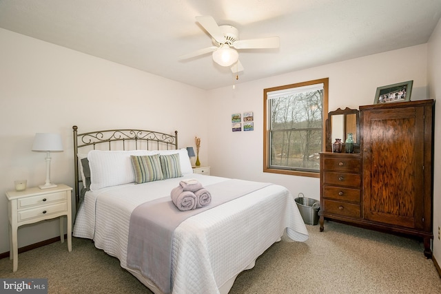 bedroom with light carpet and ceiling fan