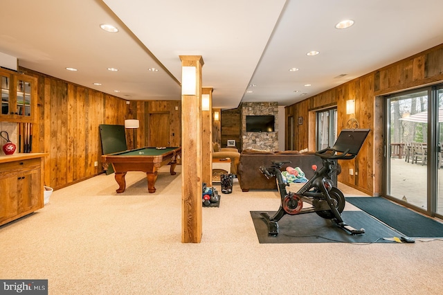 workout room with light colored carpet, wooden walls, and billiards