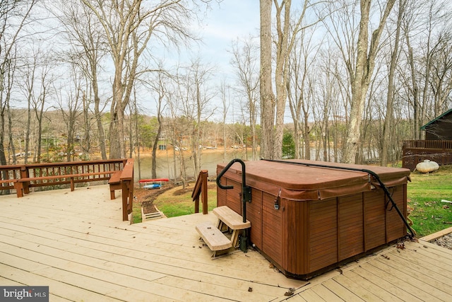 wooden deck with a hot tub