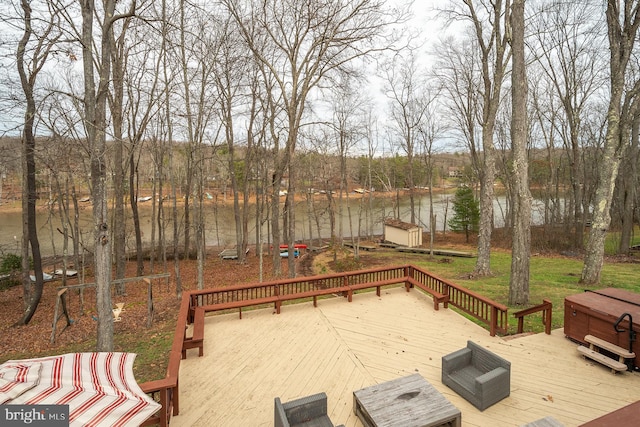 wooden deck featuring a jacuzzi