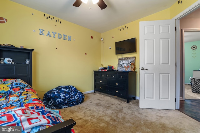 bedroom with ceiling fan, light colored carpet, and lofted ceiling