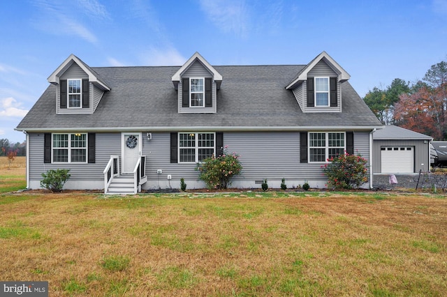 cape cod-style house featuring a front lawn and a garage