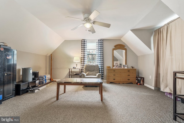 home office featuring carpet flooring, vaulted ceiling, and ceiling fan