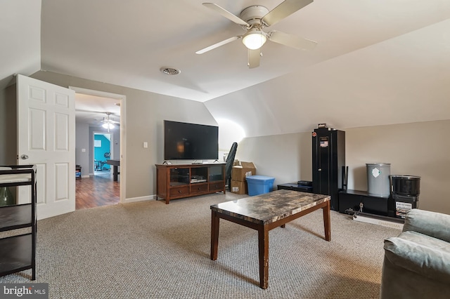 living room with ceiling fan, carpet, and lofted ceiling