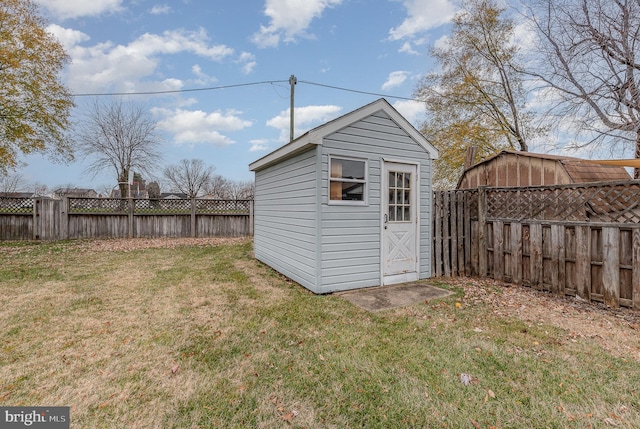 view of outbuilding featuring a lawn