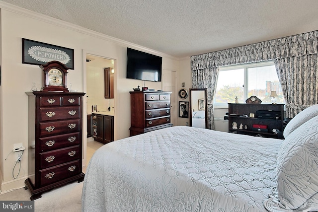 bedroom featuring light colored carpet, crown molding, and a textured ceiling