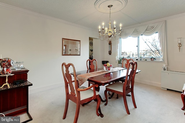 carpeted dining area featuring a notable chandelier and ornamental molding