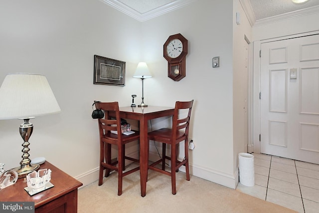 tiled dining space with a textured ceiling and crown molding