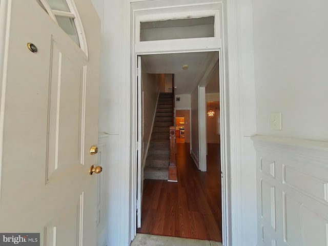 corridor featuring wood-type flooring