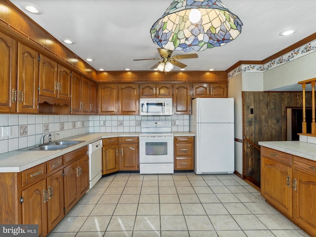 kitchen featuring ceiling fan, white appliances, sink, and light tile patterned floors