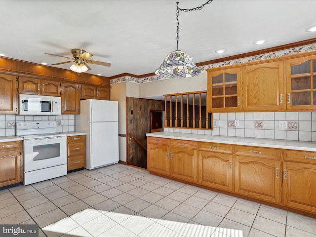 kitchen featuring ceiling fan, light tile patterned floors, pendant lighting, and white appliances