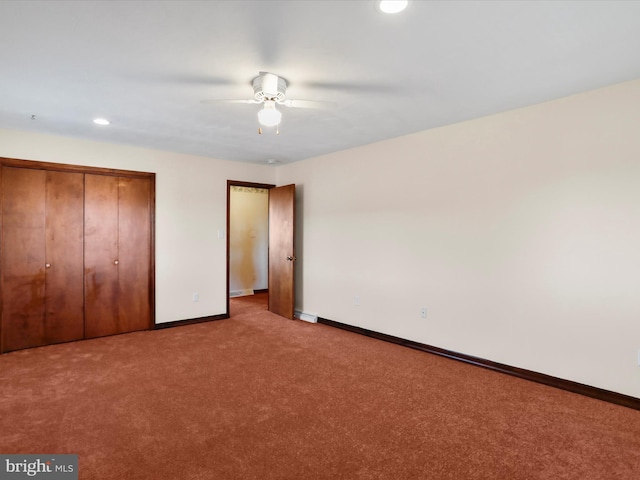 unfurnished bedroom with ceiling fan, light colored carpet, and a closet