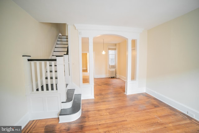 interior space featuring wood-type flooring and radiator