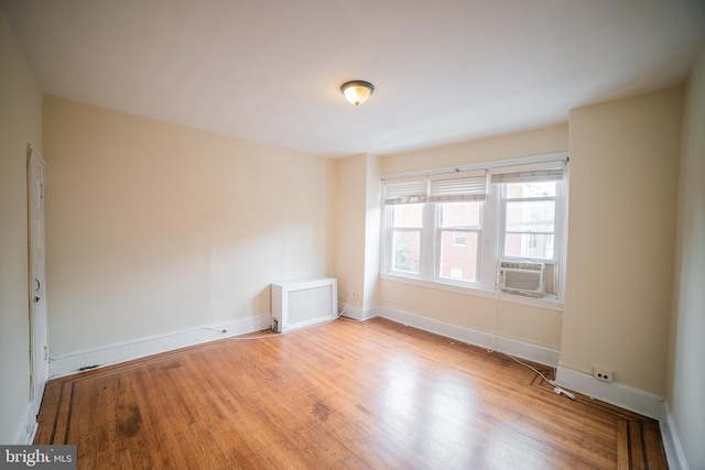 unfurnished room with light hardwood / wood-style flooring