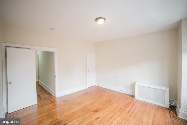 empty room with light hardwood / wood-style floors