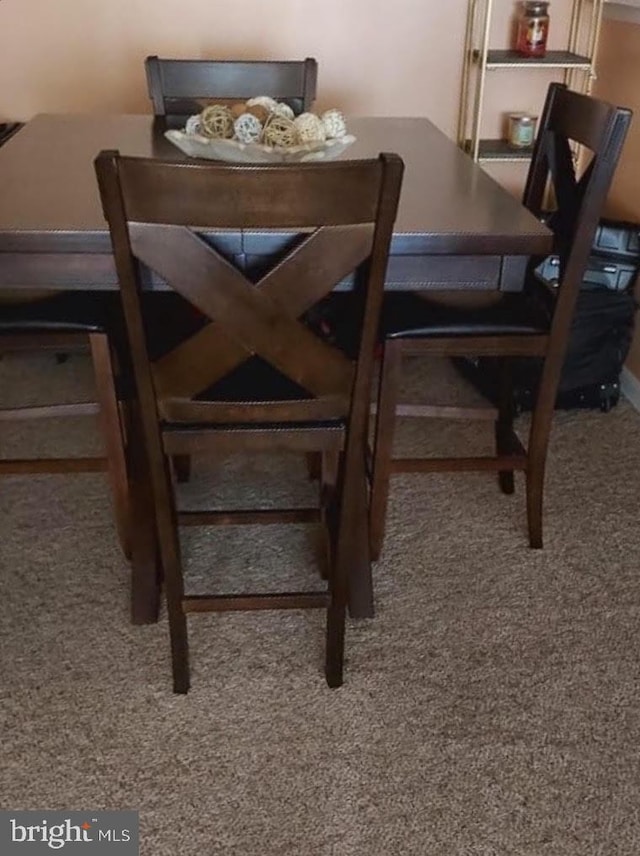 dining space with carpet