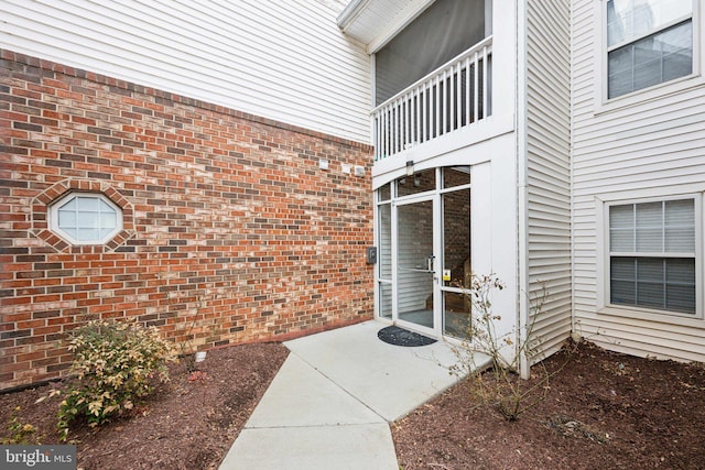 doorway to property with a balcony