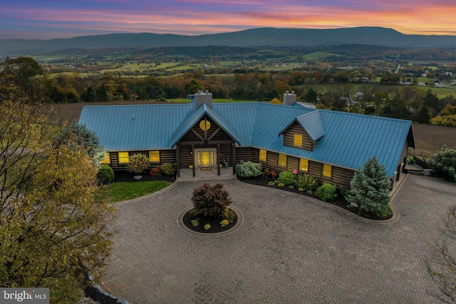 log cabin featuring a mountain view